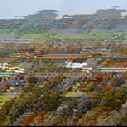 Steam train going over Stanway Viaduct in the Autumn